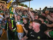 1 June 2024; The Offaly captain Dan Bourke lifts the James Nowlan Cup after the oneills.com GAA Hurling All-Ireland U20 Championship final match between Offaly and Tipperary at UPMC Nowlan Park in Kilkenny. Photo by Ray McManus/Sportsfile
