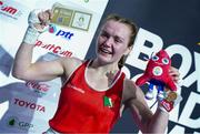 2 June 2024; Jennifer Lehane of Ireland celebrates while holding a ticket and a mascot after winning in Women's 54kg Quarterfinals against Hanna Lakotar of Hungary at the Paris 2024 Olympic Boxing Qualification Tournament at Hua Mak Indoor Stadium in Bangkok, Thailand. Photo by Joe Walsh/Sportsfile