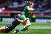 2 June 2024; Eve Higgins of Ireland is tackled by Alex Sedrick of USA during the HSBC Women's SVNS 2024 Grand Finals play-off match between Ireland and USA at Civitas Metropolitano Stadium in Madrid, Spain. Photo by Juan Gasparini/Sportsfile