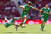 2 June 2024; Chay Mullins of Ireland is tackled by Impi Visser of South Africa during the HSBC Men's SVNS 2024 Grand Finals Pool B match between Ireland and South Africa at Civitas Metropolitano Stadium in Madrid, Spain. Photo by Juan Gasparini/Sportsfile