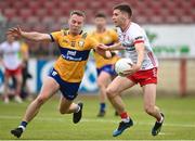2 June 2024; Niall Devlin of Tyrone in action against Gavin Murray of Clare  during the GAA Football All-Ireland Senior Championship Round 2 match between Tyrone and Clare at O'Neill's Healy Park in Omagh, Tyrone. Photo by Oliver McVeigh/Sportsfile