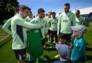 2 June 2024; Shay Cronin, from Ennis, Clare, is presented with a jersey by Seamus Coleman and the Republic of Ireland squad before a Republic of Ireland training session at the FAI National Training Centre in Abbotstown, Dublin. Photo by Stephen McCarthy/Sportsfile