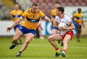 2 June 2024; Niall Devlin of Tyrone in action against Gavin Murray of Clare during the GAA Football All-Ireland Senior Championship Round 2 match between Tyrone and Clare at O'Neill's Healy Park in Omagh, Tyrone. Photo by Oliver McVeigh/Sportsfile