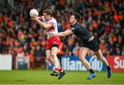 2 June 2024; Brendan Rogers of Derry in action against Ben Crealey of Armagh during the GAA Football All-Ireland Senior Championship Round 2 match between Derry and Armagh at Celtic Park in Derry. Photo by Seb Daly/Sportsfile