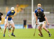 2 June 2024; Conor Grace of Tipperary Blue in action against Aidan Carroll of Kilkenny during the Electric Ireland Corn Michael Hogan Celtic Challenge final match between Tipperary Blue and Kilkenny at UPMC Nowlan Park in Kilkenny. Photo by Tom Beary/Sportsfile