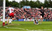2 June 2024; Conor Turbitt of Armagh scores his side's second goal, past Derry goalkeeper Odhran Lynch and Brendan Rogers, during the GAA Football All-Ireland Senior Championship Round 2 match between Derry and Armagh at Celtic Park in Derry. Photo by Seb Daly/Sportsfile
