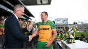 2 June 2024; GAA President Jarlath Burns presents Stephen Gillespie of Donegal with a trophy to mark his 100th game after the Nickey Rackard Cup final match between Donegal and Mayo at Croke Park in Dublin. Photo by Ray McManus/Sportsfile