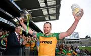 2 June 2024; Stephen Gillespie of Donegal with the Nickey Rackard Cup and a trophy to mark his 100th game after the Nickey Rackard Cup final match between Donegal and Mayo at Croke Park in Dublin. Photo by Ray McManus/Sportsfile