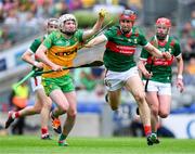 2 June 2024; Ruairi Campbell of Donegal is tackled by Adrian Philips of Mayo during the Nickey Rackard Cup final match between Donegal and Mayo at Croke Park in Dublin. Photo by Ray McManus/Sportsfile