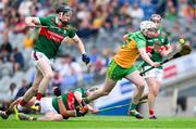 2 June 2024; Ruairi Campbell of Donegal is tackled by Oisín Greally and David Kenny of Mayo during the Nickey Rackard Cup final match between Donegal and Mayo at Croke Park in Dublin. Photo by Ray McManus/Sportsfile