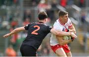 2 June 2024; Ciaran McFaul of Derry in action against Barry McCambridge of Armagh during the GAA Football All-Ireland Senior Championship Round 2 match between Derry and Armagh at Celtic Park in Derry. Photo by Seb Daly/Sportsfile