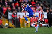 3 June 2024; Connor Parsons of Waterford has a shot on goal despite the attention of Adam O'Reilly of Derry City during the SSE Airtricity Men's Premier Division match between Derry City and Waterford at The Ryan McBride Brandywell Stadium in Derry. Photo by Ben McShane/Sportsfile