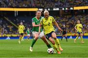 4 June 2024; Jonna Andersson of Sweden in action against Kyra Carusa of Republic of Ireland during the 2025 UEFA Women's European Championship qualifying match between Sweden and Republic of Ireland at Friends Arena in Stockholm, Sweden. Photo by Stephen McCarthy/Sportsfile