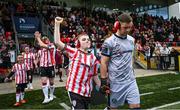 7 June 2024; Derry City goalkeeper Brian Maher walks out with his mascot, as part of the club's 'Different Together' project, before the SSE Airtricity Men's Premier Division match between Derry City and Galway United at The Ryan McBride Brandywell Stadium in Derry. Photo by Ramsey Cardy/Sportsfile