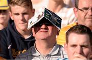 14 September 2013; A supporter uses the match programme to shield his eyes from the sun. Bord Gáis Energy GAA Hurling Under 21 All-Ireland 'A' Championship Final, Antrim v Clare, Semple Stadium, Thurles, Co. Tipperary. Picture credit: Ray McManus / SPORTSFILE