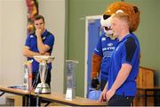 19 September 2013; Pictured at the official launch of Leinster Rugby’s Bank of Ireland Treble Trophy Tour at Newbridge Post Primary School, Co. Kildare, is Leinster academy player and local Newbridge lad James Tracy as he answers questions from the children of the school. Schools interested in turning their school Leinster Blue and receiving a visit from the treble trophies, the Amlin Challenge Cup, RaboDirect PRO12, British and Irish Cup should email - trophy@leinsterrugby.ie. Supported by Bank of Ireland, Newbridge Post Primary School, was the first school to receive the three trophies on their provincial tour which continues throughout the school year. Leinster fans can keep up to date by following @leinstertrophytour on Twitter or at www.Facebook.com/leinsterrugbytrophytour! Newbridge Post Primary School, Newbridge, Co. Kildare. Picture credit: Barry Cregg / SPORTSFILE