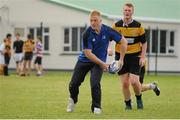 19 September 2013; Pictured taking part in a game of tag rugby with the students at the official launch of Leinster Rugby’s Bank of Ireland Treble Trophy Tour at Newbridge Post Primary School, Co. Kildare, is Leinster academy player and local Newbridge lad James Tracy. Schools interested in turning their school Leinster Blue and receiving a visit from the treble trophies, the Amlin Challenge Cup, RaboDirect PRO12, British and Irish Cup should email - trophy@leinsterrugby.ie. Supported by Bank of Ireland, Newbridge Post Primary School, was the first school to receive the three trophies on their provincial tour which continues throughout the school year. Leinster fans can keep up to date by following @leinstertrophytour on Twitter or at www.Facebook.com/leinsterrugbytrophytour! Newbridge Post Primary School, Newbridge, Co. Kildare. Picture credit: Barry Cregg / SPORTSFILE