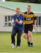 19 September 2013; Pictured taking part in a game of tag rugby with the students at the official launch of Leinster Rugby’s Bank of Ireland Treble Trophy Tour at Newbridge Post Primary School, Co. Kildare, is Leinster academy player and local Newbridge lad James Tracy. Schools interested in turning their school Leinster Blue and receiving a visit from the treble trophies, the Amlin Challenge Cup, RaboDirect PRO12, British and Irish Cup should email - trophy@leinsterrugby.ie. Supported by Bank of Ireland, Newbridge Post Primary School, was the first school to receive the three trophies on their provincial tour which continues throughout the school year. Leinster fans can keep up to date by following @leinstertrophytour on Twitter or at www.Facebook.com/leinsterrugbytrophytour! Newbridge Post Primary School, Newbridge, Co. Kildare. Picture credit: Barry Cregg / SPORTSFILE