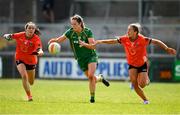 8 June 2024; Marion Farrelly of Meath in action against Grace Ferguson, right, and Roisin Mulligan of Armagh during the TG4 All-Ireland Ladies Senior Football Championship Round 1 match between Armagh and Meath at BOX-IT Athletic Grounds in Armagh. Photo by Tyler Miller/Sportsfile