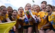 8 June 2024; Antrim captain Ella McLaughlin lifts the trophy with team-mates following the 2024 All-Ireland U14 Bronze Final between Limerick and Antrim at Coralstown Kinnegad GAA Club in Kinnegad, Westmeath. Photo by Shauna Clinton/Sportsfile