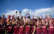 8 June 2024; Galway captain Ciara O'Neill lifts the trophy with team-mates following the 2024 All-Ireland U14 Platinum Final between Cavan and Galway at Coralstown Kinnegad GAA Club in Kinnegad, Westmeath. Photo by Shauna Clinton/Sportsfile