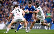 8 June 2024; Ross Byrne of Leinster in action against Jude Postlethwaite, left, and Greg Jones of Ulster during the United Rugby Championship quarter-final match between Leinster and Ulster at Aviva Stadium in Dublin. Photo by Ramsey Cardy/Sportsfile
