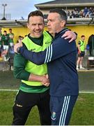 8 June 2024; Leitrim manager Andy Moran, left, and Wicklow manager Oisín McConville shake hands after the Tailteann Cup preliminary quarter-final match between Leitrim and Wicklow at Glennon Brothers Pearse Park in Longford. Photo by Stephen Marken/Sportsfile