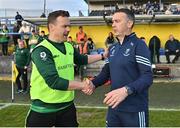 8 June 2024; Leitrim manager Andy Moran, left, and Wicklow manager Oisín McConville shake hands after the Tailteann Cup preliminary quarter-final match between Leitrim and Wicklow at Glennon Brothers Pearse Park in Longford. Photo by Stephen Marken/Sportsfile