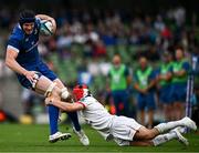 8 June 2024; Ryan Baird of Leinster is tackled by Mike Lowry of Ulster during the United Rugby Championship quarter-final match between Leinster and Ulster at the Aviva Stadium in Dublin. Photo by Harry Murphy/Sportsfile