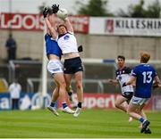 9 June 2024; Eoghan McElligot of New York in action against Brian Byrne of Laois during the Tailteann Cup preliminary quarter-final match between Laois and New York at Laois Hire O'Moore Park in Portlaoise, Laois. Photo by Tom Beary/Sportsfile