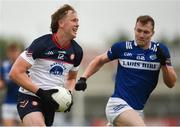 9 June 2024; Eoghan McElligot of New York in action against Niall Dunne of Limerick during the Tailteann Cup preliminary quarter-final match between Laois and New York at Laois Hire O'Moore Park in Portlaoise, Laois. Photo by Tom Beary/Sportsfile