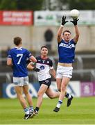 9 June 2024; Ciaran Burke of Laois in action against Shane Brosnan of New York during the Tailteann Cup preliminary quarter-final match between Laois and New York at Laois Hire O'Moore Park in Portlaoise, Laois. Photo by Tom Beary/Sportsfile