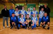 9 June 2024; The Finn Harps team and staff pose for a photograph with the trophy and Former Dundalk player Greg Sloggett during the FAI / League of Ireland Down Syndrome festival at Gormanston Park in Gormanston, Meath. Photo by Tyler Miller/Sportsfile