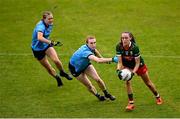 9 June 2024; Maria Cannon of Mayo in action against Dublin players Lauren Magee, centre, and Grace Kós during the TG4 All-Ireland Ladies Football Senior Championship Round 1 match between Dublin and Mayo at Parnell Park in Dublin. Photo by Seb Daly/Sportsfile