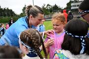 9 June 2024; Jennifer Dunne of Dublin signs autographs for supporters after the TG4 All-Ireland Ladies Football Senior Championship Round 1 match between Dublin and Mayo at Parnell Park in Dublin. Photo by Seb Daly/Sportsfile