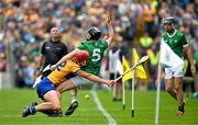9 June 2024; Diarmaid Byrnes of Limerick is tackled by Peter Duggan of Clare during the Munster GAA Hurling Senior Championship final match between Clare and Limerick at FBD Semple Stadium in Thurles, Tipperary. Photo by Brendan Moran/Sportsfile