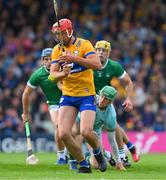 9 June 2024; Peter Duggan of Clare shoots past Limerick goalkeeper Nickie Quaid to score a goal, on the stroke of half time, during the Munster GAA Hurling Senior Championship final match between Clare and Limerick at FBD Semple Stadium in Thurles, Tipperary. Photo by Ray McManus/Sportsfile