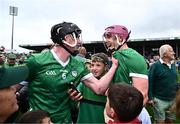9 June 2024; Limerick players Declan Hannon, left, and Shane O'Brien celebrate after their side's victory in the Munster GAA Hurling Senior Championship final match between Clare and Limerick at FBD Semple Stadium in Thurles, Tipperary. Photo by Piaras Ó Mídheach/Sportsfile