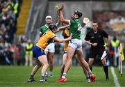 9 June 2024; Gearóid Hegarty of Limerick in action against David McInerney, left, and David Fitzgerald of Clare during the Munster GAA Hurling Senior Championship final match between Clare and Limerick at FBD Semple Stadium in Thurles, Tipperary. Photo by Piaras Ó Mídheach/Sportsfile