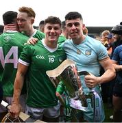 9 June 2024; Limerick players, from left, Adam English anbd Jason Gillane celebrate with the Mick Mackey cup after the Munster GAA Hurling Senior Championship final match between Clare and Limerick at FBD Semple Stadium in Thurles, Tipperary. Photo by Brendan Moran/Sportsfile