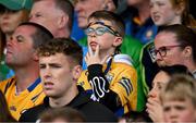 9 June 2024; A young Clare supporter looks on during the Munster GAA Hurling Senior Championship final match between Clare and Limerick at FBD Semple Stadium in Thurles, Tipperary. Photo by Brendan Moran/Sportsfile