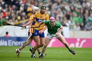 9 June 2024; Shane O'Brien of Limerick in action against Cathal Malone of Clare during the Munster GAA Hurling Senior Championship final match between Clare and Limerick at FBD Semple Stadium in Thurles, Tipperary. Photo by Brendan Moran/Sportsfile