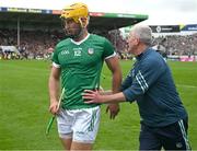 9 June 2024; Tom Morrissey of Limerick is congratulated by Limerick manager John Kiely as he is substituted during the Munster GAA Hurling Senior Championship final match between Clare and Limerick at FBD Semple Stadium in Thurles, Tipperary. Photo by Ray McManus/Sportsfile