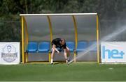 10 June 2024; Interim head coach John O'Shea redirects a water sprinkler during a Republic of Ireland training session at Estádio de São Miguel in Gondomar, Portugal. Photo by Stephen McCarthy/Sportsfile
