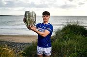11 June 2024; David Dooley of Laois poses for a portrait with the Liam MacCarthy cup during the national launch of the GAA Hurling All-Ireland Senior Championship at Spanish Point in Clare. Photo by Brendan Moran/Sportsfile