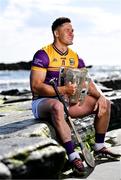11 June 2024; Lee Chin of Wexford poses for a portrait with the Liam MacCarthy cup during the national launch of the GAA Hurling All-Ireland Senior Championship at Spanish Point in Clare. Photo by Brendan Moran/Sportsfile