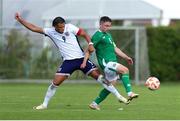 11 June 2024; Joe Hodge of Republic of Ireland is tackled by Dane Scarlett of England during the international friendly match between England U20's and Republic of Ireland U21's at Gradski Stadion in Zagreb, Croatia. Photo by Vid Ponikvar/Sportsfile