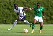 11 June 2024; Romain Esse of England in action against Aidomo Emakhu of Republic of Ireland during the international friendly match between England U20's and Republic of Ireland U21's at Gradski Stadion in Zagreb, Croatia. Photo by Vid Ponikvar/Sportsfile