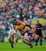 9 June 2024; John Conlon of Clare is tackled by Declan Hannon of Limerick during the Munster GAA Hurling Senior Championship final match between Clare and Limerick at FBD Semple Stadium in Thurles, Tipperary. Photo by Ray McManus/Sportsfile