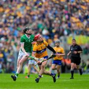 9 June 2024; John Conlon of Clare and Declan Hannon of Limerick keep their eyes on the sliotar during the Munster GAA Hurling Senior Championship final match between Clare and Limerick at FBD Semple Stadium in Thurles, Tipperary. Photo by Ray McManus/Sportsfile